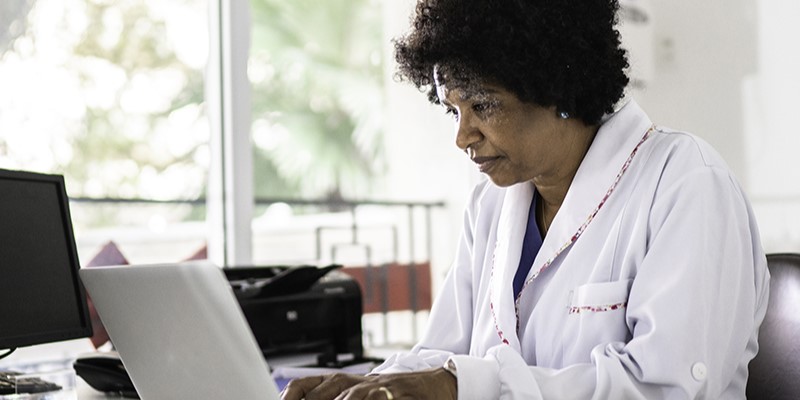 doctor at a computer